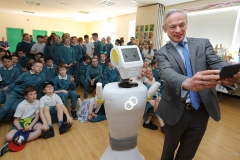 PRESS RELEASE... NO REPRODUCTION FEE..RISE OF THE MACHINES: Minister for Education, Richard Bruton T.D. and Stevie the Robot, a high tech prototype robot designed to work in assisted care facilities visited the students of Gaelscoil Cholmcille in Coolock, Dublin 17 today.  To coincide with the visit, the parents committee erected three billboards outside their to raise awareness of their longstanding campaign for a permanent school building. (More info: Laura Robertson 087 12 12 500)Pictured today : Minister for Education, Richard Bruton T.D takes a selfie with Stevie The Robot during a visit to Gaelscoil Cholmcille in CoolockPIC : Lorraine O'Sullivan/Sharppix